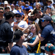 A young fan is carted away after being hit with a foul ball hit by Los Angeles Dodgers’ Cody Bellinger during the first inning of a baseball game against the Colorado Rockies, Sunday, June 23, 2019, in Los Angeles.